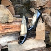 Heels on a pile of logs in the Dordogne