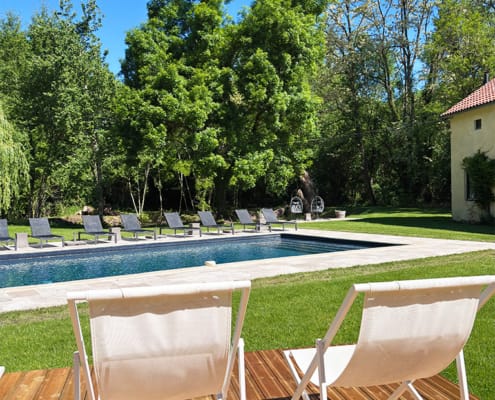 Deck chairs and sun loungers by the pool