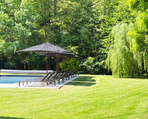 Gite swimming pool and lush green lawn
